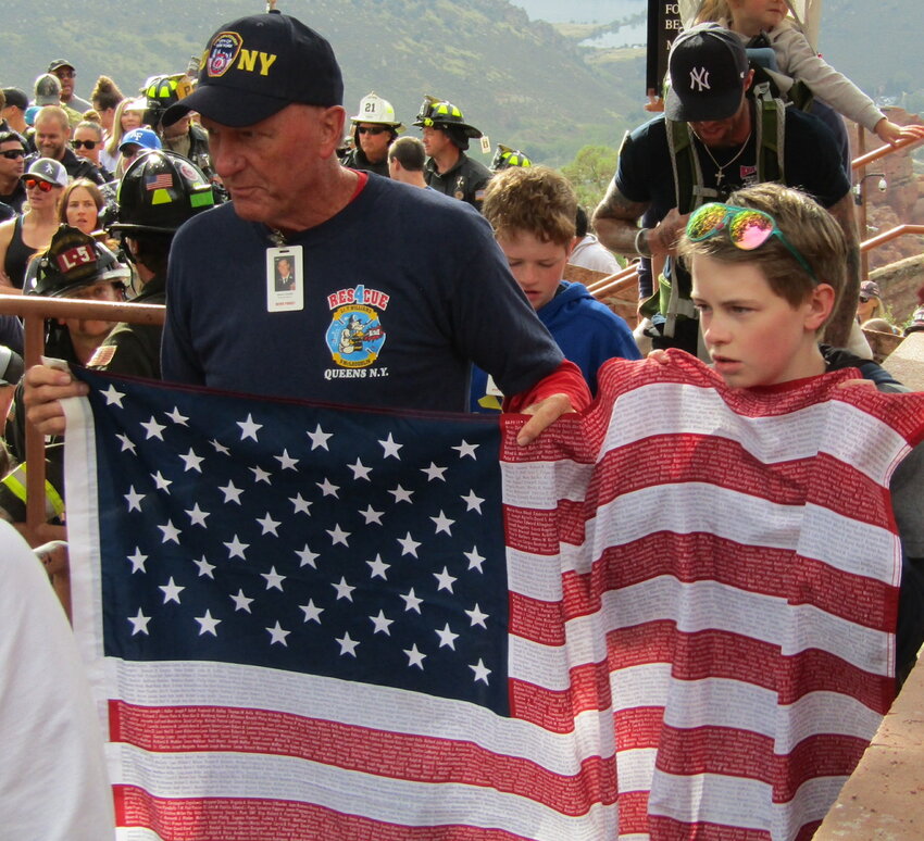 Tim Dowdell and his grandson Logan participate in the stair climb to honor Tim’s brother, Lt. Kevin C. Dowdell, who died in the 9/11 attack on the Twin Towers in New York City.